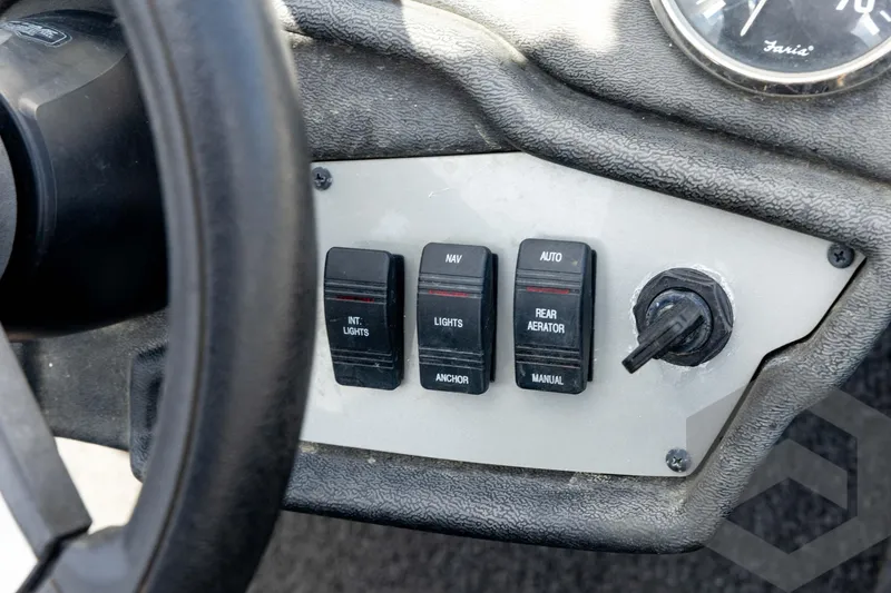 Slide: The Image of Control panel of a 2020 Ranger RT188P boat with switches and steering wheel. - 47