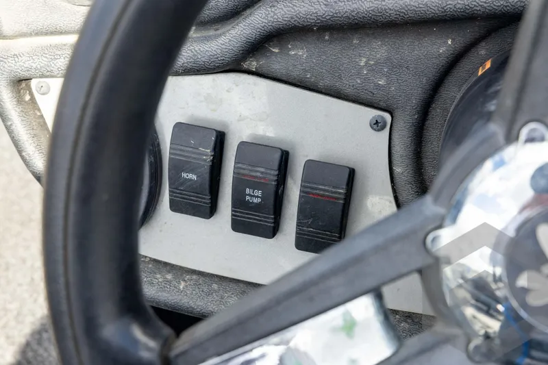 Slide: The Image of 2020 Ranger RT188P boat dashboard with horn and bilge pump switches. - 48