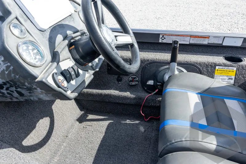 Slide: The Image of 2020 Ranger RT188P boat interior with steering wheel and seat, showcasing dashboard controls. - 50