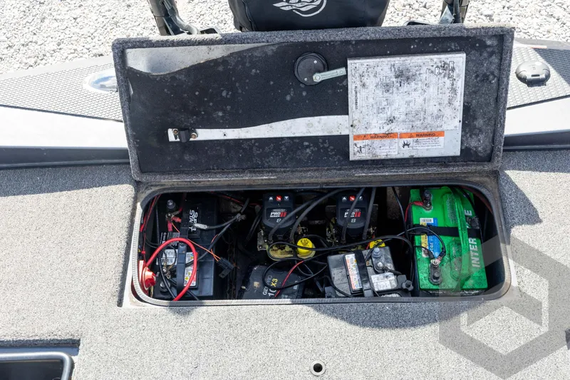 Slide: The Image of 2020 Ranger RT188P boat battery compartment with multiple batteries and wiring. - 53