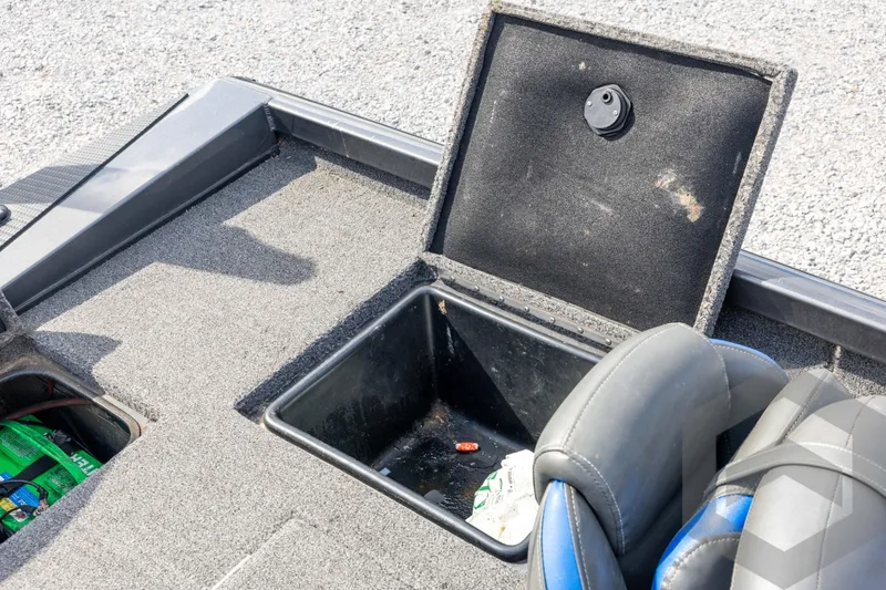 Slide: The Image of 2020 Ranger RT188P boat storage compartment with open lid and visible interior. - 55