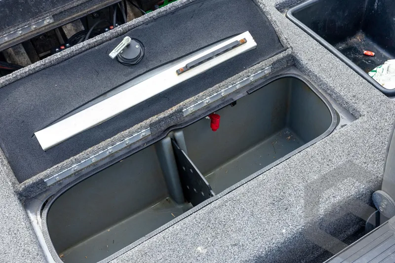 Slide: The Image of 2020 Ranger RT188P boat storage compartment with open lid, showcasing interior space. - 56
