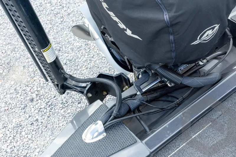 Slide: The Image of 2020 Ranger RT188P boat engine with protective cover on gravel surface. - 59