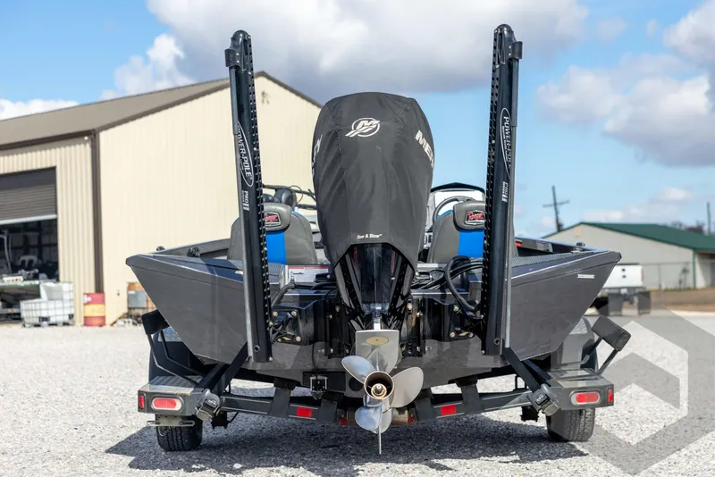 Slide: The Image of 2020 Ranger RT188P boat with covered engine, parked outdoors on a trailer. - 6