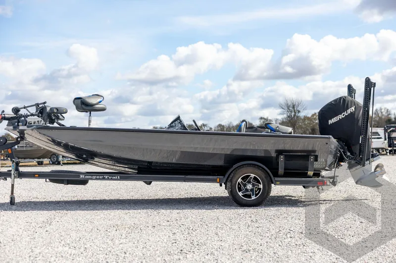 Slide: The Image of 2020 Ranger RT188P fishing boat on trailer, side view, under cloudy sky. - 8