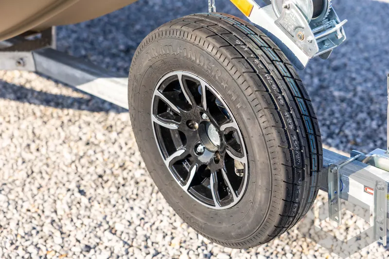 Slide: The Image of Trailer wheel of 2026 G3 Gator Tough 1548 VBW on gravel surface. - 10