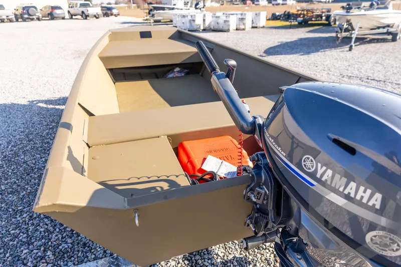 Slide: The Image of 2026 G3 Gator Tough 1548 VBW boat with Yamaha motor, parked on gravel lot. - 22