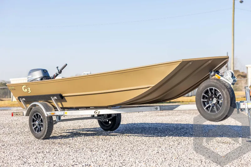 Slide: The Image of 2026 G3 Gator Tough 1548 VBW boat on trailer, parked on gravel. - 3