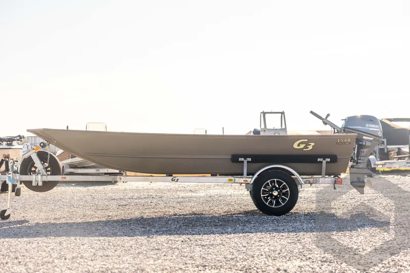 Slide: The Image of 2026 G3 Gator Tough 1548 VBW boat on trailer, side view in sunlight. - 8
