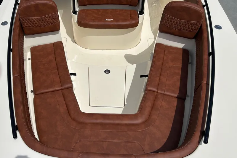 Slide: The Image of Luxurious brown leather seating on 2025 Scout 277 LXF boat interior. - 27
