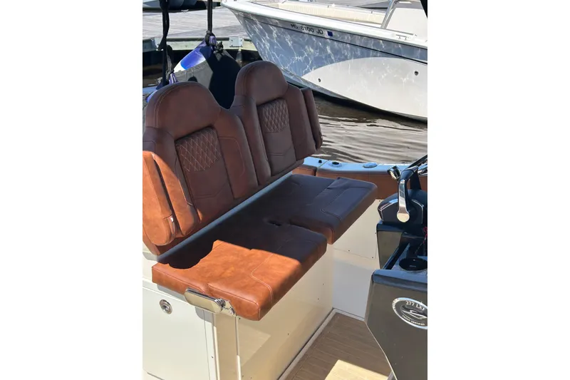 Slide: The Image of 2025 Scout 277 LXF boat with luxurious brown leather seating. - 45