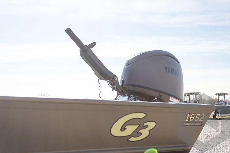 Slide: The Image of 2026 G3 Gator Tough 1652 VBW boat with Yamaha engine, side view. - 20