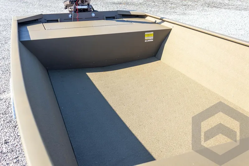 Slide: The Image of 2026 G3 Gator Tough 1652 VBW boat interior with motor, on gravel surface. - 23