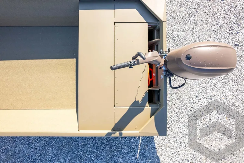 Slide: The Image of Top view of 2026 G3 Gator Tough 1652 VBW boat with motor on gravel. - 30