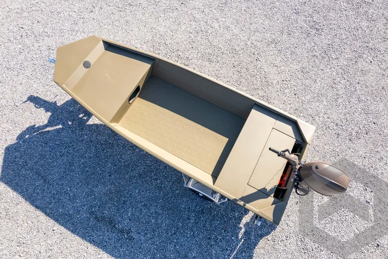 Slide: The Image of 2026 G3 Gator Tough 1652 VBW boat on gravel surface, aerial view. - 33