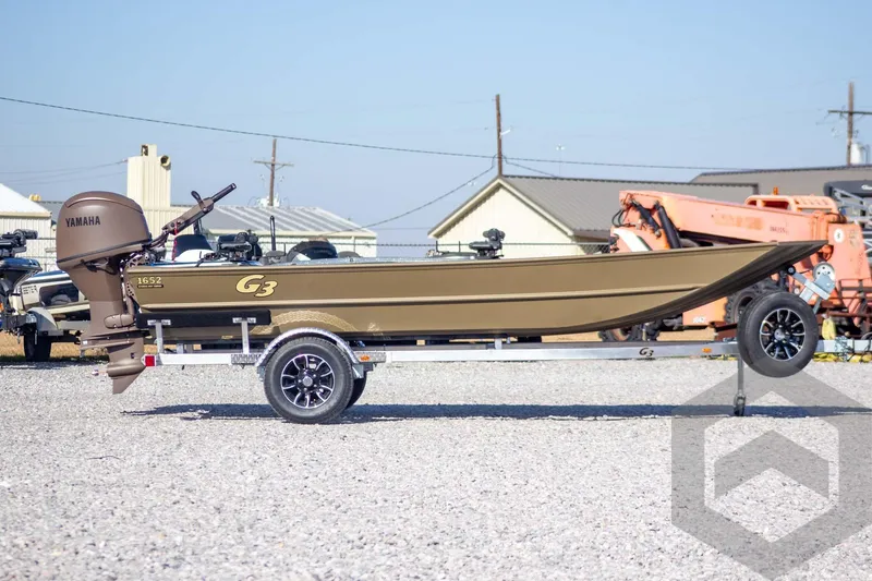 Slide: The Image of 2026 G3 Gator Tough 1652 VBW boat on trailer, featuring Yamaha outboard motor. - 8