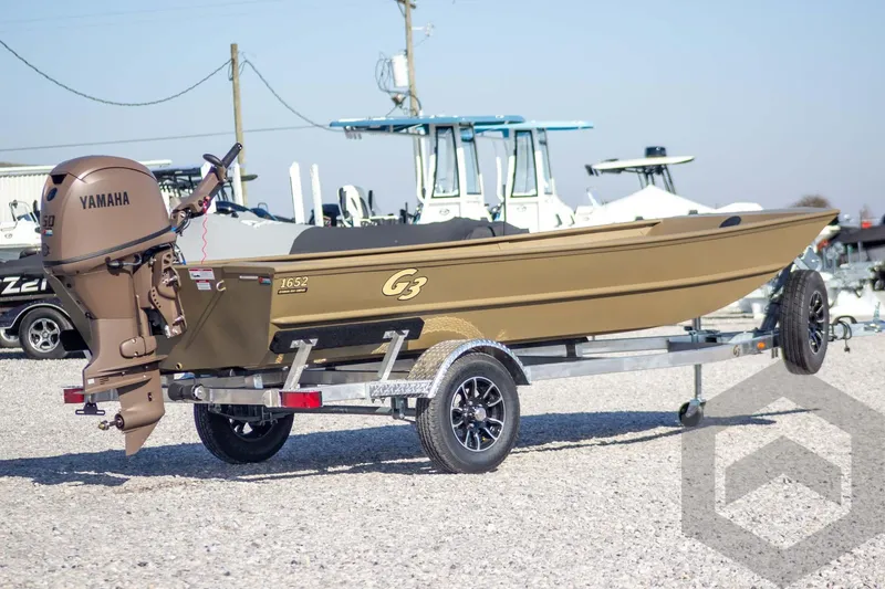 Slide: The Image of 2026 G3 Gator Tough 1652 VBW boat on trailer with Yamaha outboard motor. - 9