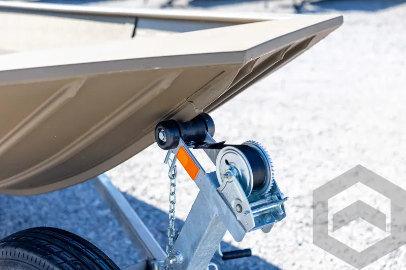 Slide: The Image of Trailer hitch of 2026 G3 Gator Tough 1860 VBW boat on gravel surface. - 11