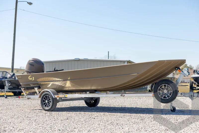 Slide: The Image of 2026 G3 Gator Tough 1860 VBW boat on trailer, outdoor display. - 3