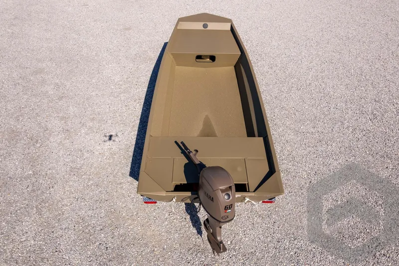 Slide: The Image of 2026 G3 Gator Tough 1860 VBW boat with Yamaha motor on gravel surface. - 33