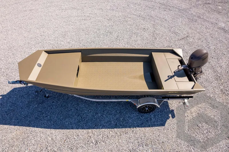 Slide: The Image of 2026 G3 Gator Tough 1860 VBW boat on trailer, gravel background. - 35