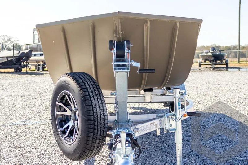 Slide: The Image of 2026 G3 Gator Tough 1652 VBW boat on trailer, gravel lot background. - 10