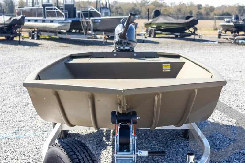 Slide: The Image of 2026 G3 Gator Tough 1652 VBW boat on trailer, displayed outdoors. - 11