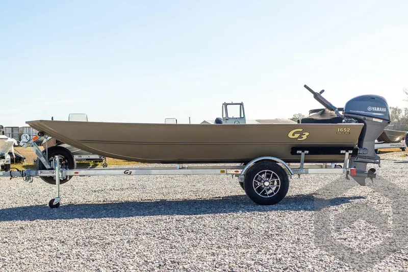 Slide: The Image of 2026 G3 Gator Tough 1652 VBW boat on trailer, side view. - 17