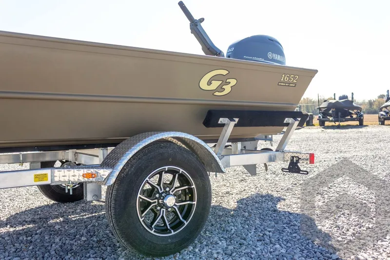 Slide: The Image of 2026 G3 Gator Tough 1652 VBW boat on trailer, featuring Yamaha engine. - 18