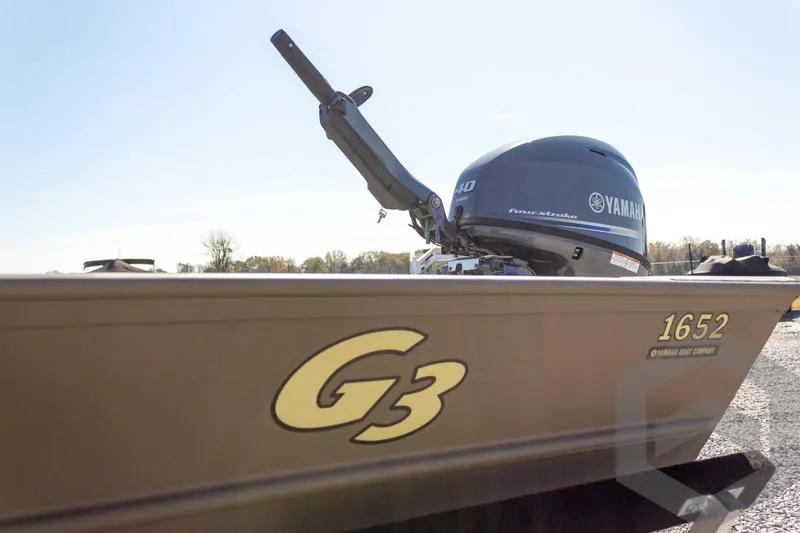 Slide: The Image of 2026 G3 Gator Tough 1652 VBW boat with Yamaha engine, side view. - 19
