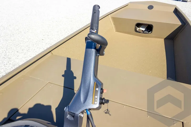 Slide: The Image of 2026 G3 Gator Tough 1652 VBW boat interior with steering handle, beige finish. - 30