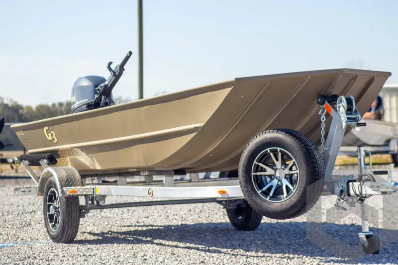 Slide: The Image of 2026 G3 Gator Tough 1652 VBW boat on trailer, side view. - 4