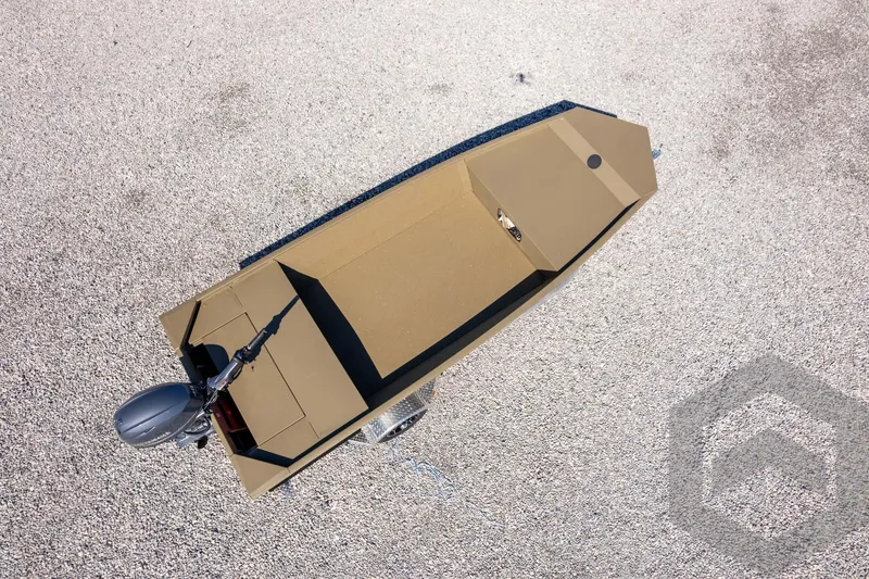 Slide: The Image of 2026 G3 Gator Tough 1652 VBW boat, aerial view on gravel surface. - 43