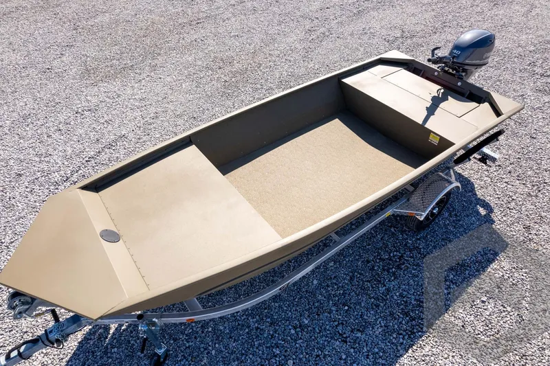 Slide: The Image of 2026 G3 Gator Tough 1652 VBW boat on trailer, gravel background. - 48