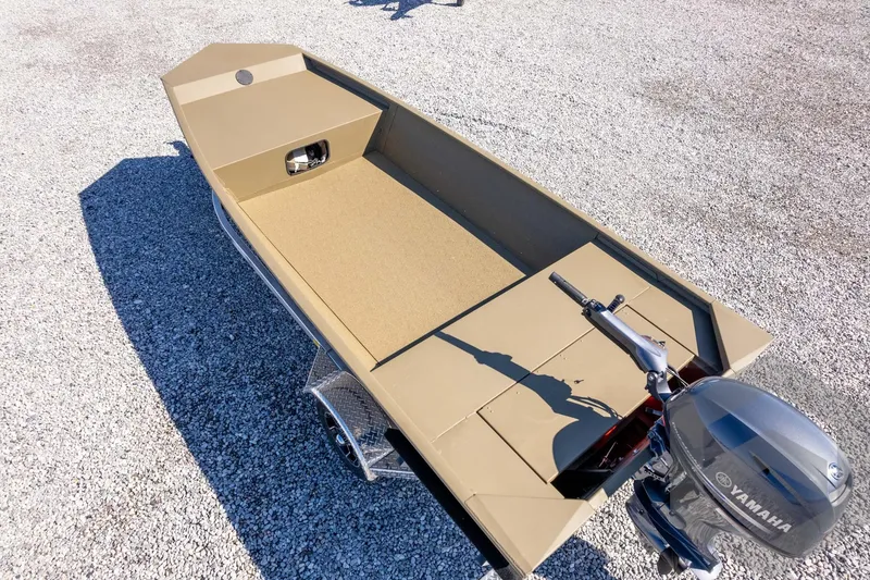 Slide: The Image of 2026 G3 Gator Tough 1652 VBW boat with Yamaha motor on gravel surface. - 49