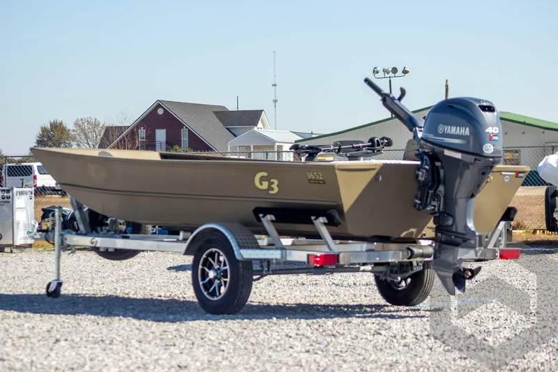 Slide: The Image of 2026 G3 Gator Tough 1652 VBW boat on trailer with Yamaha motor, outdoor setting. - 7