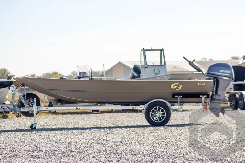 Slide: The Image of 2026 G3 Gator Tough 1652 VBW boat on trailer with Yamaha outboard motor. - 8