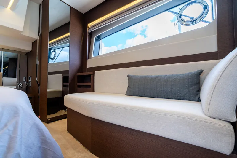 Slide: The Image of Luxurious interior of 2022 Prestige 520 yacht with elegant seating and large window. - 10