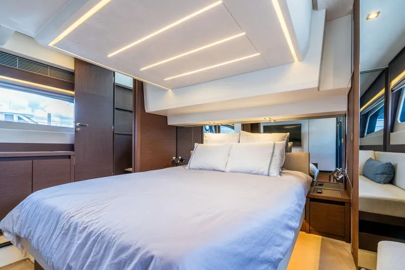 Slide: The Image of Luxurious bedroom interior of 2022 Prestige 520 yacht with modern lighting and elegant design. - 11
