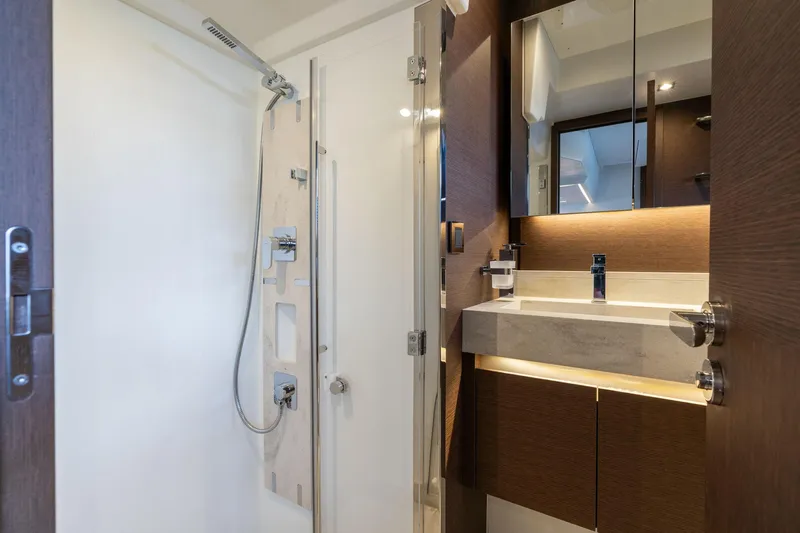 Slide: The Image of Luxurious bathroom interior of 2022 Prestige 520 yacht, featuring modern shower and sleek vanity. - 14