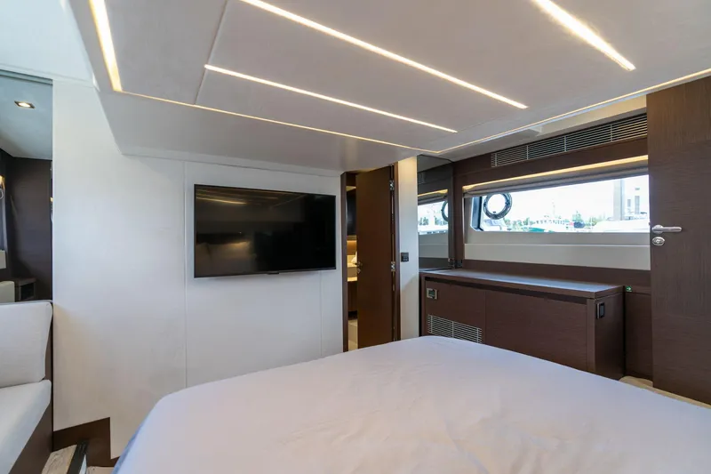Slide: The Image of Luxurious interior of 2022 Prestige 520 yacht with modern design and flat-screen TV. - 17