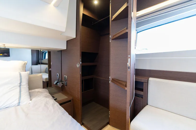 Slide: The Image of Luxurious interior of 2022 Prestige 520 yacht with open closet and modern furnishings. - 18
