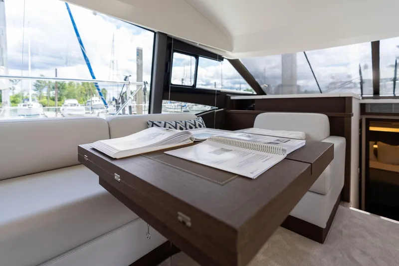 Slide: The Image of Luxurious interior of 2022 Prestige 520 yacht with elegant seating and table. - 26