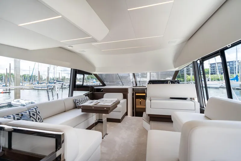 Slide: The Image of Luxurious interior of 2022 Prestige 520 yacht with modern seating and marina view. - 28