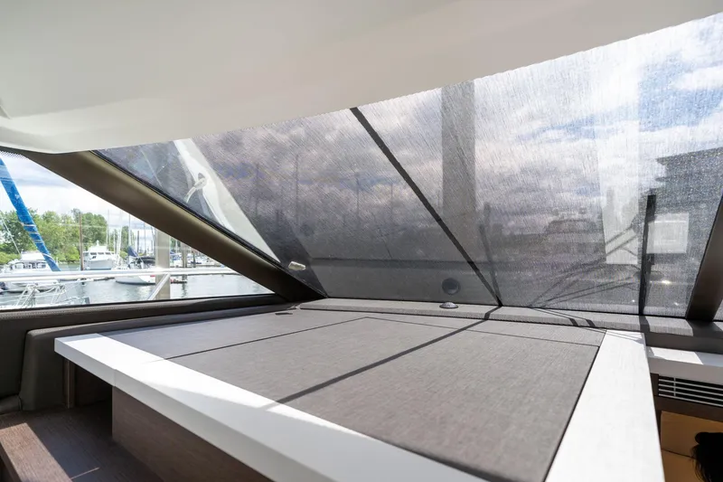 Slide: The Image of Interior view of 2022 Prestige 520 yacht with large windows and modern design. - 29