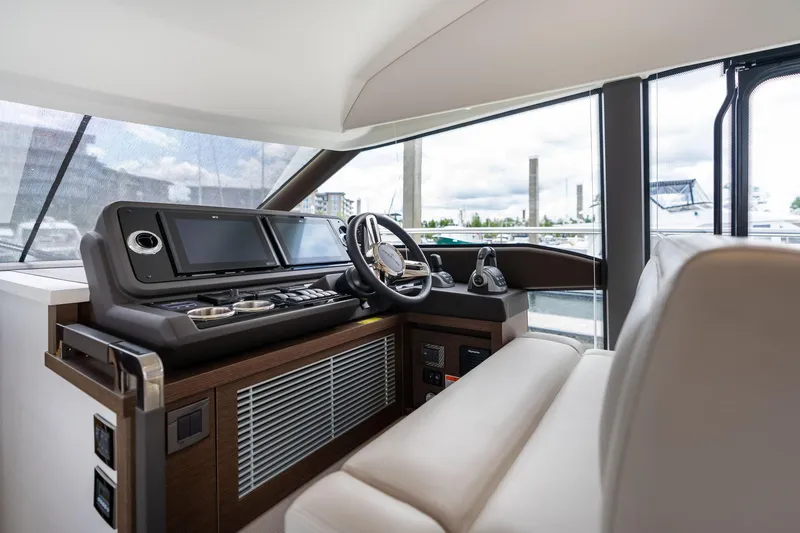 Slide: The Image of Luxurious interior of 2022 Prestige 520 yacht with modern helm and navigation controls. - 31