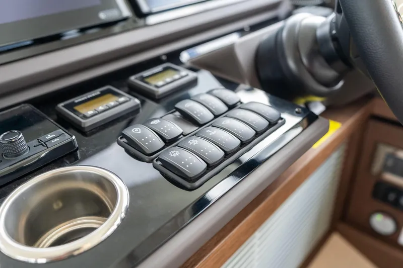 Slide: The Image of Control panel of a 2022 Prestige 520 yacht with buttons and displays. - 36