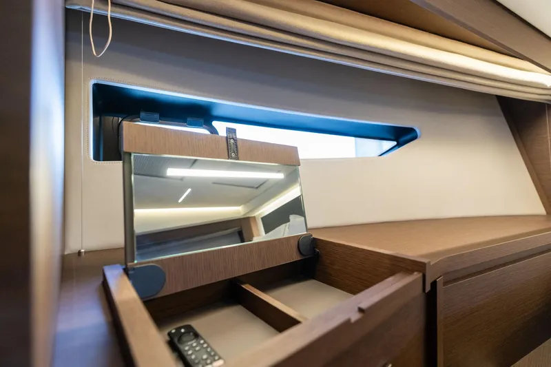 Slide: The Image of Interior of 2022 Prestige 520 yacht with wooden cabinetry and mirror. - 44