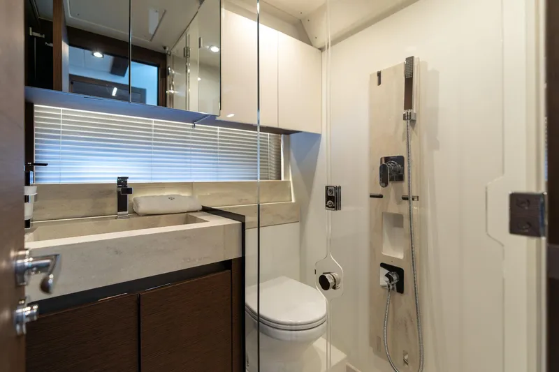 Slide: The Image of Luxurious bathroom in 2022 Prestige 520 yacht, featuring modern fixtures and elegant design. - 46