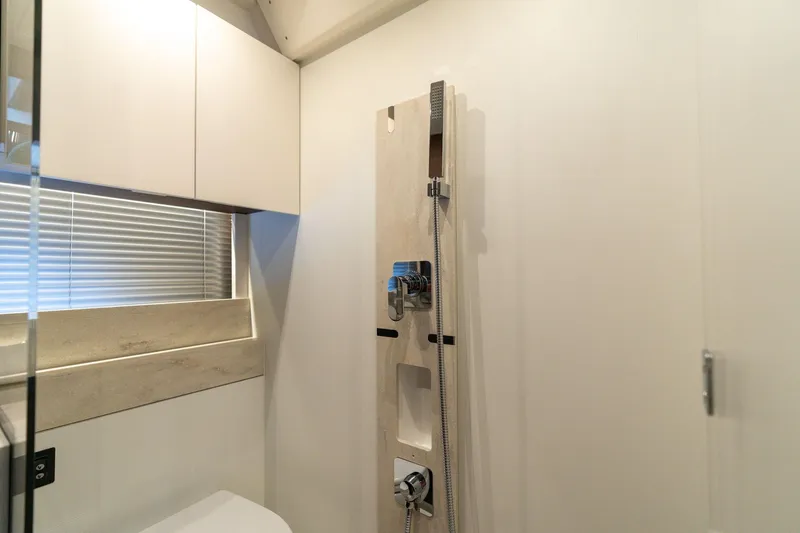 Slide: The Image of Modern bathroom interior in 2022 Prestige 520 yacht, featuring sleek shower design. - 47